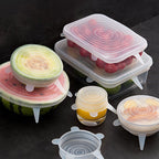Set of silicone food covers on a dark surface